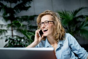 group coaching woman on phone